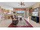 Cozy living room with plush seating, tile flooring, and seamless access to the screened lanai at 12076 Se 178Th St, Summerfield, FL 34491