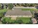 Rear view of the house showing a large backyard and shed at 12854 Se 118Th Ter, Ocklawaha, FL 32179