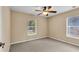 Spacious bedroom with ceiling fan and large windows at 12854 Se 118Th Ter, Ocklawaha, FL 32179
