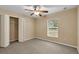 Bright bedroom featuring neutral walls and carpet at 12854 Se 118Th Ter, Ocklawaha, FL 32179