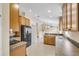 Kitchen with wood cabinets, black appliances, and tiled flooring at 12854 Se 118Th Ter, Ocklawaha, FL 32179