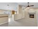 Spacious living room featuring a fireplace and vaulted ceiling at 12854 Se 118Th Ter, Ocklawaha, FL 32179
