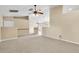 Spacious living room with neutral carpet, ceiling fans, and an open layout at 12854 Se 118Th Ter, Ocklawaha, FL 32179