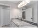 Modern bathroom with granite countertop and white cabinets at 1302 Ne 22Nd Ave, Ocala, FL 34470