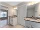 Bathroom with dual vanities and granite countertops at 1302 Ne 22Nd Ave, Ocala, FL 34470