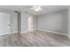 Spacious bedroom with ceiling fan and access to bathroom at 1302 Ne 22Nd Ave, Ocala, FL 34470