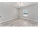 Bright bedroom with ceiling fan and wood-look floors at 1302 Ne 22Nd Ave, Ocala, FL 34470
