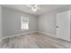 Bright bedroom with ceiling fan and wood-look floors at 1302 Ne 22Nd Ave, Ocala, FL 34470