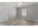 Bright bedroom with ceiling fan and wood-look floors at 1302 Ne 22Nd Ave, Ocala, FL 34470
