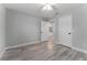 Spacious bedroom with ceiling fan and access to bathroom at 1302 Ne 22Nd Ave, Ocala, FL 34470