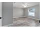 Bright bedroom with ceiling fan and wood-look flooring at 1302 Ne 22Nd Ave, Ocala, FL 34470