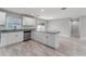 Modern kitchen with white cabinets, granite countertops, and stainless steel appliances at 1302 Ne 22Nd Ave, Ocala, FL 34470