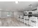 Open concept kitchen with stainless steel appliances and island at 1302 Ne 22Nd Ave, Ocala, FL 34470