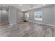 Bright and airy living room with wood-look flooring at 1302 Ne 22Nd Ave, Ocala, FL 34470