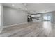Open concept living and kitchen area with wood-look floors at 1302 Ne 22Nd Ave, Ocala, FL 34470