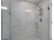 Large walk-in shower with tiled walls and multiple shower heads at 1302 Ne 22Nd Ave, Ocala, FL 34470
