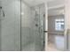 Walk-in shower with glass enclosure and tiled walls at 1302 Ne 22Nd Ave, Ocala, FL 34470