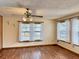 Bright living room with wood floors and multiple windows at 14497 Ne 189Th Pl, Fort Mc Coy, FL 32134