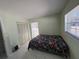 Bright bedroom with a floral comforter and tiled floors at 15083 Sw 43Rd Terrace Rd, Ocala, FL 34473