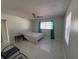 Bedroom with a bed, chair, and tile floors at 15083 Sw 43Rd Terrace Rd, Ocala, FL 34473