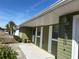 House exterior showcasing the front entrance and a tiled patio area at 15083 Sw 43Rd Terrace Rd, Ocala, FL 34473