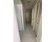 Hallway with light green walls and tile floors at 15083 Sw 43Rd Terrace Rd, Ocala, FL 34473
