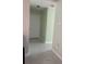 Hallway with light green walls and tile floors at 15083 Sw 43Rd Terrace Rd, Ocala, FL 34473