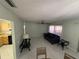 Spacious living room with tiled floors and a leather sofa at 15083 Sw 43Rd Terrace Rd, Ocala, FL 34473