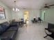 Open living room and dining area with tile floors at 15083 Sw 43Rd Terrace Rd, Ocala, FL 34473