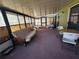 Relaxing screened porch with seating at 15083 Sw 43Rd Terrace Rd, Ocala, FL 34473