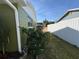 Side yard with green grass and fence at 15083 Sw 43Rd Terrace Rd, Ocala, FL 34473