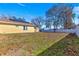 House with solar panels and large backyard with leaf covered lawn at 15391 Se 90Th Ct, Summerfield, FL 34491