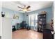 Well-lit bedroom with a workspace and built-in shelving at 15391 Se 90Th Ct, Summerfield, FL 34491