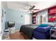 Spacious bedroom with ceiling fan and ample closet space at 15391 Se 90Th Ct, Summerfield, FL 34491