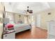 Spacious bedroom with tile floors, a ceiling fan, and a queen-size bed at 15391 Se 90Th Ct, Summerfield, FL 34491