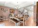 Bright dining room with a table and bench seating at 15391 Se 90Th Ct, Summerfield, FL 34491