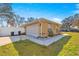 House exterior with a well-maintained lawn and driveway at 15391 Se 90Th Ct, Summerfield, FL 34491