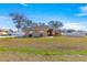 Front view of single-story house with a landscaped yard at 15391 Se 90Th Ct, Summerfield, FL 34491