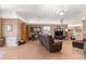 Living room with vaulted ceiling and comfortable seating at 15391 Se 90Th Ct, Summerfield, FL 34491