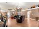 Open living area with a fireplace and comfy seating at 15391 Se 90Th Ct, Summerfield, FL 34491