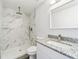 Updated bathroom with a shower and granite vanity at 15982 Sw 30 Ln, Ocala, FL 34481