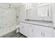 Clean bathroom, featuring a walk-in shower and marble tile at 15982 Sw 30 Ln, Ocala, FL 34481