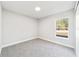 Simple bedroom with carpet and a window offering natural light at 15982 Sw 30 Ln, Ocala, FL 34481
