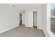 Bright bedroom with carpet flooring, a large closet, and a window at 15982 Sw 30 Ln, Ocala, FL 34481
