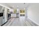 Modern kitchen featuring stainless steel appliances and sliding glass doors to backyard at 15982 Sw 30 Ln, Ocala, FL 34481