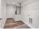 Laundry room with vinyl flooring, shelving, and a utility sink at 15982 Sw 30 Ln, Ocala, FL 34481