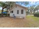 An exterior view of the home from the backyard, features include three visible windows at 18 Se 14Th Ave, Ocala, FL 34471