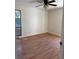 Bedroom featuring wood-look floors, ceiling fan and a window at 1804 Sw 29Th Ter, Ocala, FL 34474