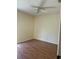 Bedroom features wood-look floors and a ceiling fan at 1804 Sw 29Th Ter, Ocala, FL 34474