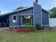 Charming single-Gathering home with blue siding, a chimney, and well-maintained landscaping at 1804 Sw 29Th Ter, Ocala, FL 34474